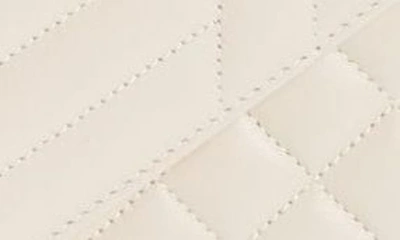 Shop Saint Laurent Medium Cassandra Quilted Leather Envelope Bag In Crema Soft