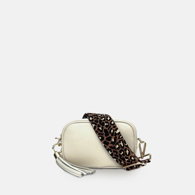 Shop Apatchy London The Mini Tassel Stone Leather Phone Bag With Tan Cheetah Strap In White