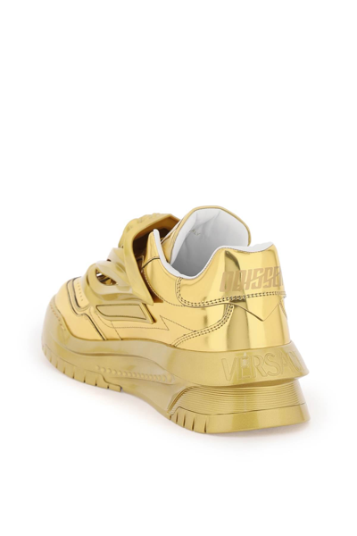 Shop Versace 'odissea' Sneakers Men In Gold