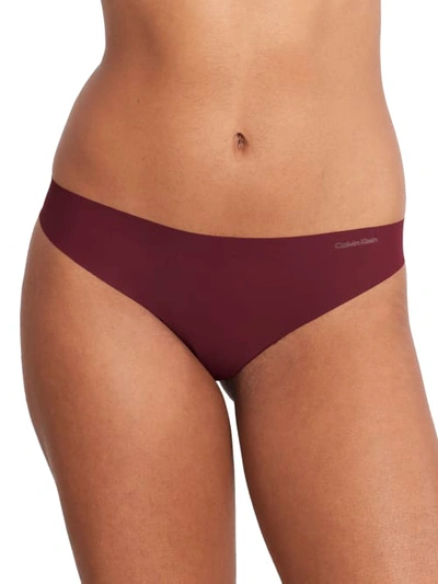 Shop Calvin Klein Invisibles Thong In Tawny Port