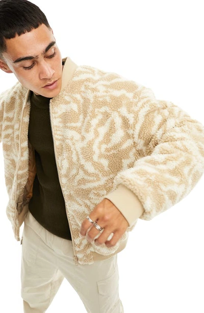 Shop Asos Design Tiger Print High Pile Fleece Bomber Jacket In Ecru