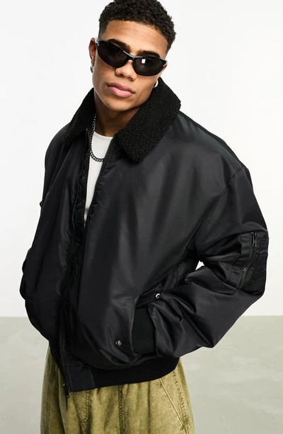 Shop Asos Design Oversize Bomber Jacket With High Pile Fleece Collar In Black