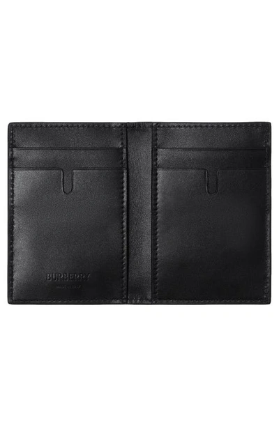 Shop Burberry Bateman Check Embossed Leather Bifold Wallet In Black