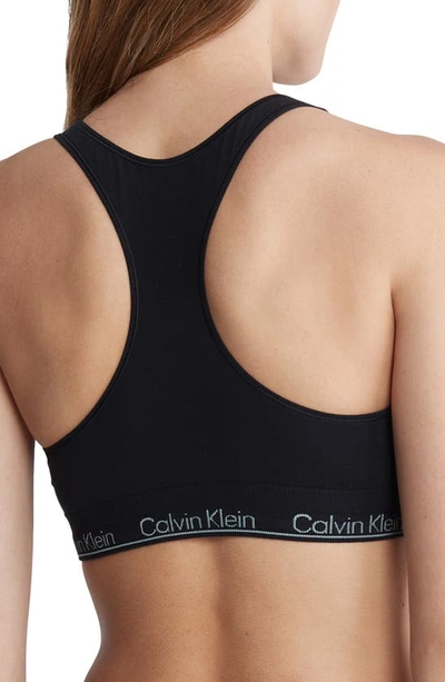 Shop Calvin Klein Logo Racerback Bralette In Black