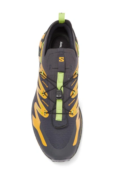 Shop Salomon Gender Inclusive Xt-rush 2 Sneaker In Ebony/ Blazing Orange/ Lime