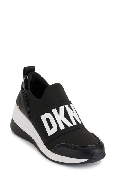 Shop Dkny Kamryn Wedge Sneaker In Black/ White