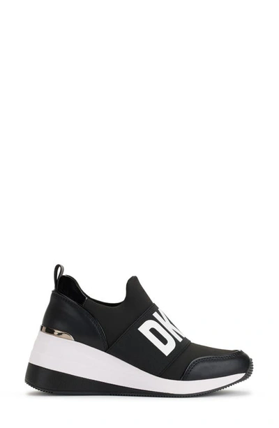 Shop Dkny Kamryn Wedge Sneaker In Black/ White