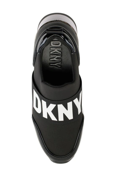 Shop Dkny Kamryn Wedge Sneaker In Black/ White