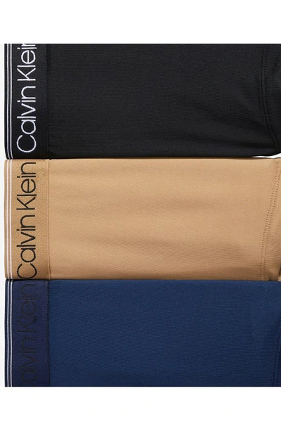 Shop Calvin Klein 3-pack Low Rise Microfiber Stretch Trunks In Beige/ Black/ Blue