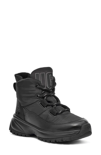 Shop Ugg Yose Puffer Waterproof Boot In Black