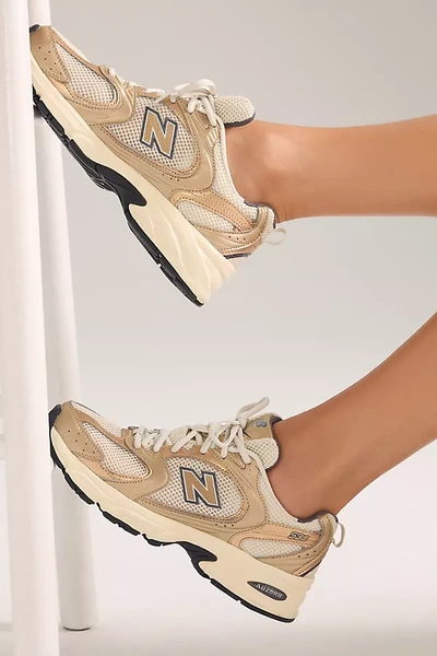 Shop New Balance 530 Sneakers In Gold