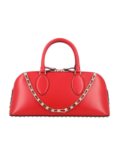 Shop Valentino Garavani Rockstud Zipped Medium Tote Bag In Red