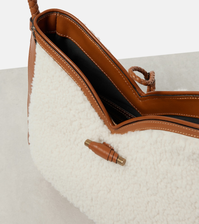 Shop Isabel Marant Vigo Medium Shearling And Leather Shoulder Bag In Brown