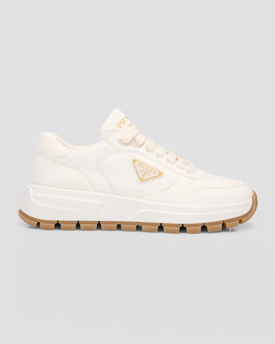 Shop Prada Leather Logo Runner Sneakers In Avorio