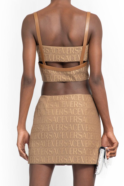 Shop Versace Tops In Brown