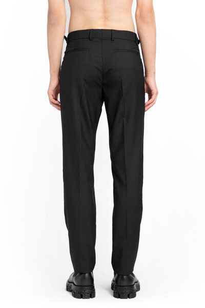 Shop Versace Trousers In Black