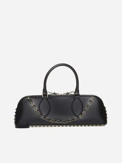 Shop Valentino East West Rockstud Leather Bag In Black