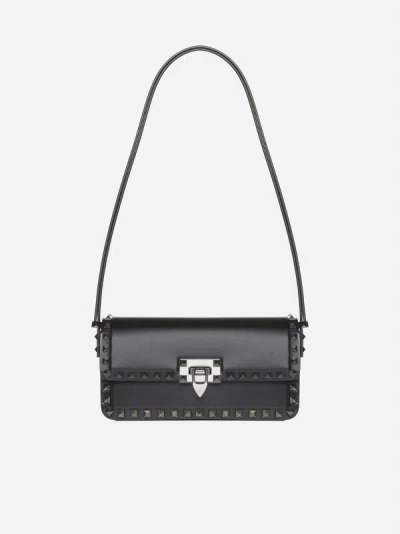 Shop Valentino East West Rockstud Leather Shoulder Bag In Black