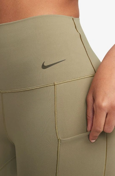 Shop Nike Universa Medium Support High Waist 7/8 Leggings In Neutral Olive/ Black