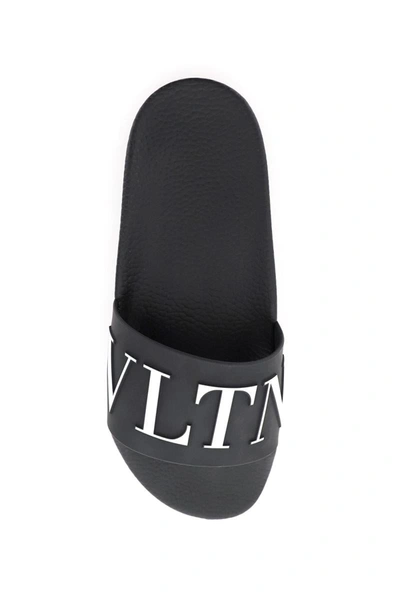 Shop Valentino Garavani Vltn Pvc Slides In Black