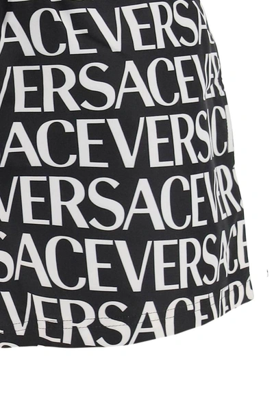 Shop Versace Allover Swim Trunks In Multicolor