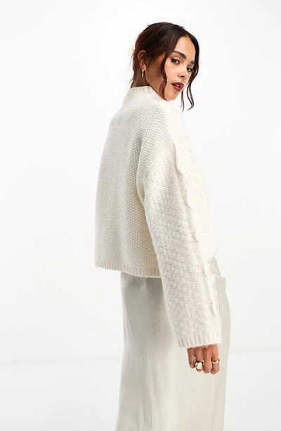 Shop Asos Design Cable Funnel Neck Crop Sweater In Cream