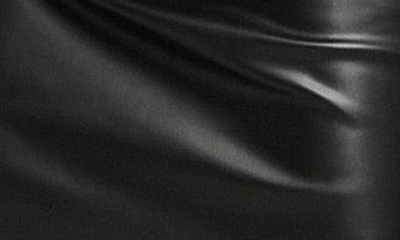 Shop Asos Design Curved Hem Faux Leather Miniskirt In Black