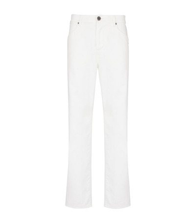 Shop Balmain Embroidered-logo Straight Jeans In White