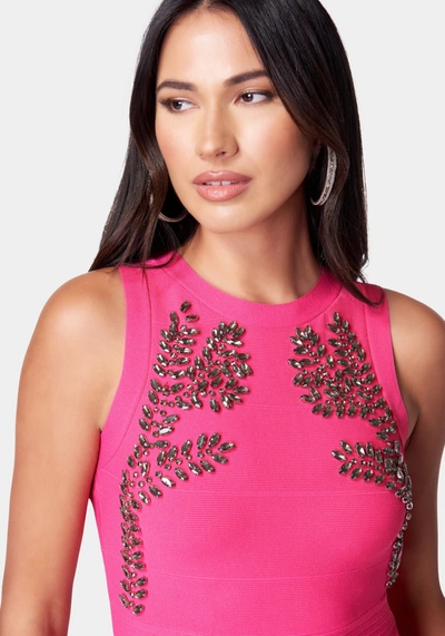 Bebe Embellished Peplum Sweater Top In Pink Peacock