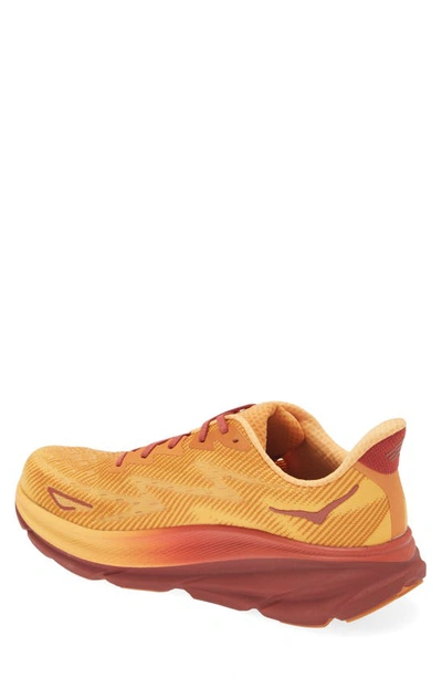 Shop Hoka Clifton 9 Running Shoe In Amber Haze / Sherbet