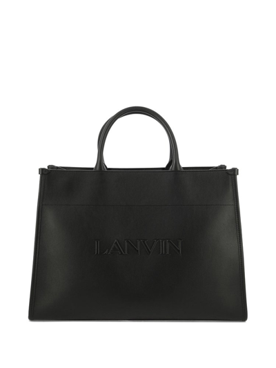 Shop Lanvin Logo Embossed Top Handle Bag In Black