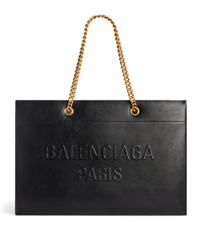 Shop Balenciaga Large Leather Duty Free Tote Bag In Black