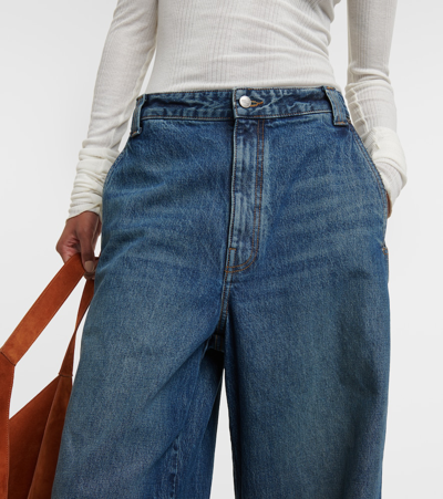 Shop Khaite Bacall Mid-rise Wide-leg Jeans In Blue