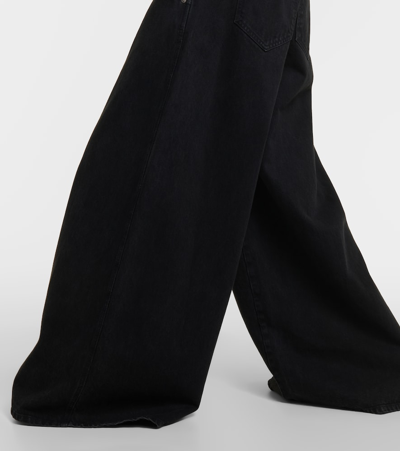 Shop Khaite Jacob Low-rise Wide-leg Jeans In Black
