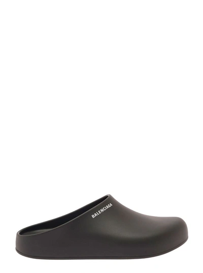 Shop Balenciaga Black Slip-on Mules With Contrasting Logo Detail In Rubber Man