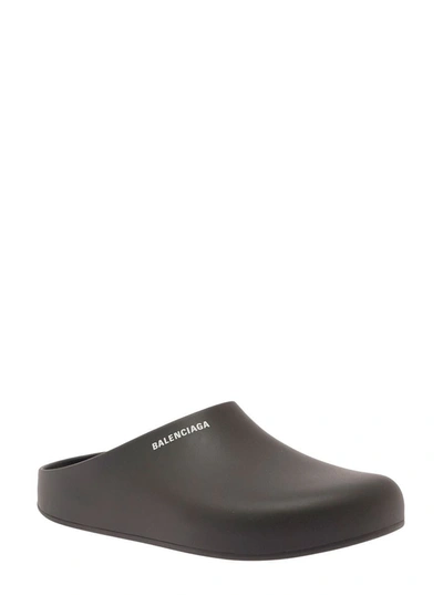 Shop Balenciaga Black Slip-on Mules With Contrasting Logo Detail In Rubber Man