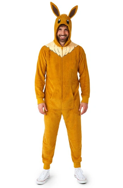 Shop Opposuits Pokémon™ Eevee Hooded Long Sleeve Fleece Jumpsuit In Beige