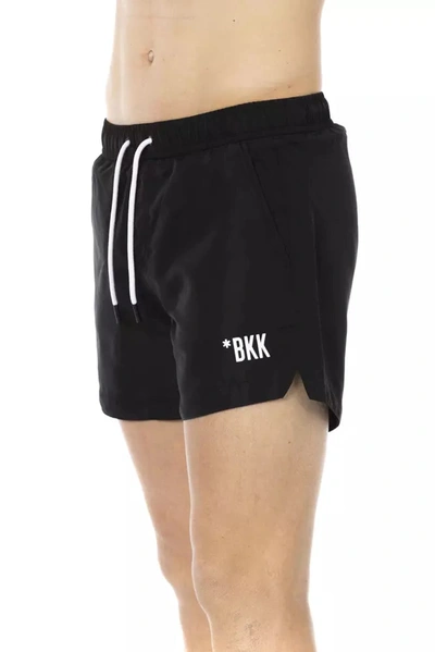 Shop Bikkembergs Chic Black Swim Shorts With Signature Men's Band