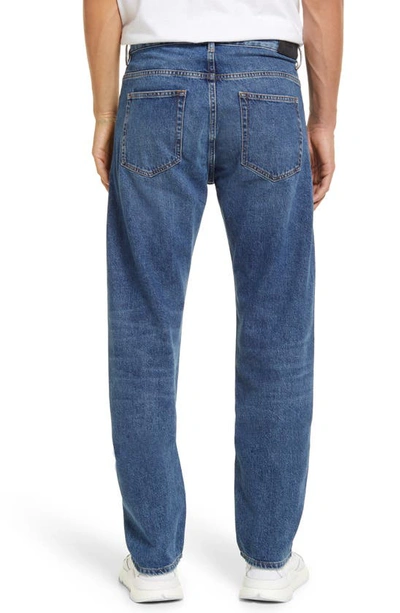 Shop Frame Reconstructed Straight Leg Jeans In Blue Washed