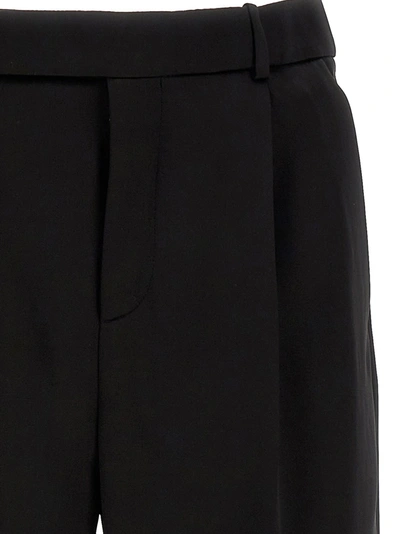 Shop Saint Laurent Flared Pants Black