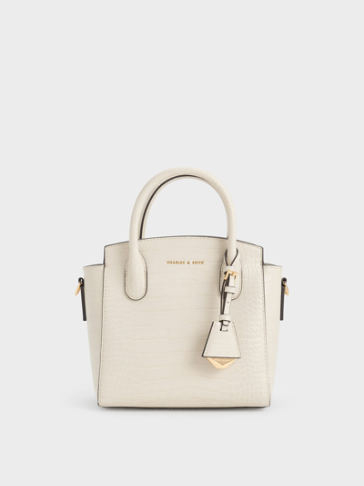 Shop Charles & Keith Croc-effect Trapeze Tote Bag In Ivory