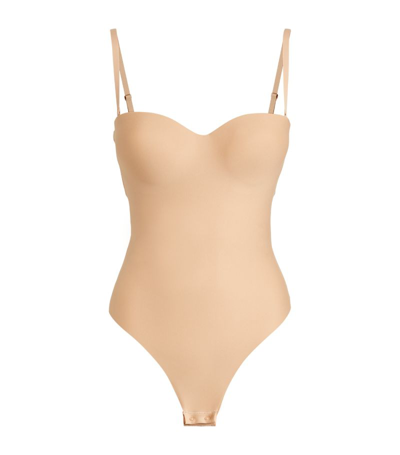 Shop Skims Moulded Underwire Thong Bodysuit In Nude