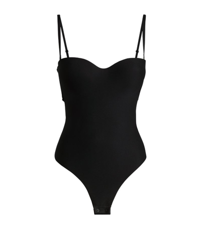 Shop Skims Moulded Underwire Thong Bodysuit In Black