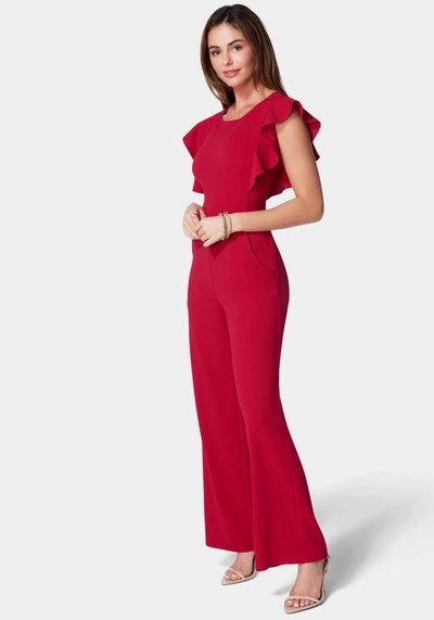Bebe Flutter Sleeve Core Jumpsuit In Red