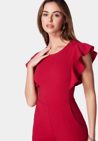 Bebe Flutter Sleeve Core Jumpsuit In Red