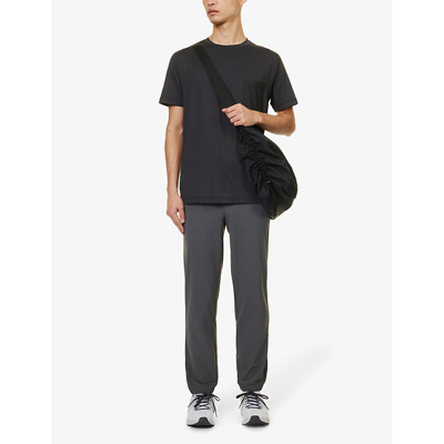 Shop Vuori Men's Black Heather Tradewind Crewneck Stretch Recycled-polyester T-shirt