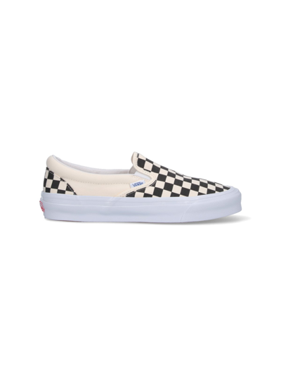 Shop Vans 'checkboard' Slip-on Sneakers In Black  