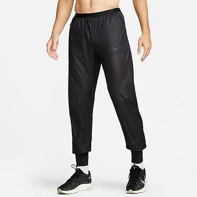 Shop Nike Men's Running Division Phenom Storm-fit Running Pants In Black