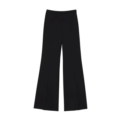 Shop Sandro Flared Trousers In Noir