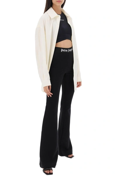 Shop Palm Angels Flared Joggers With Logoed Waistband